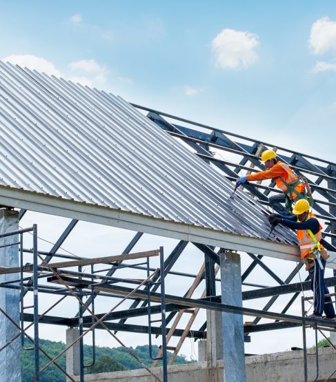 Working at height equipment.Construction worker wearing safety h Working at height equipment.Construction worker wearing safety harness are working on the roof house in construction site.